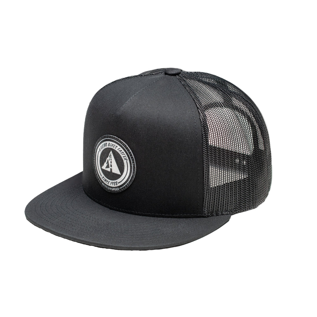 Profile Design Black trucker cap with mesh back and logo on a white background